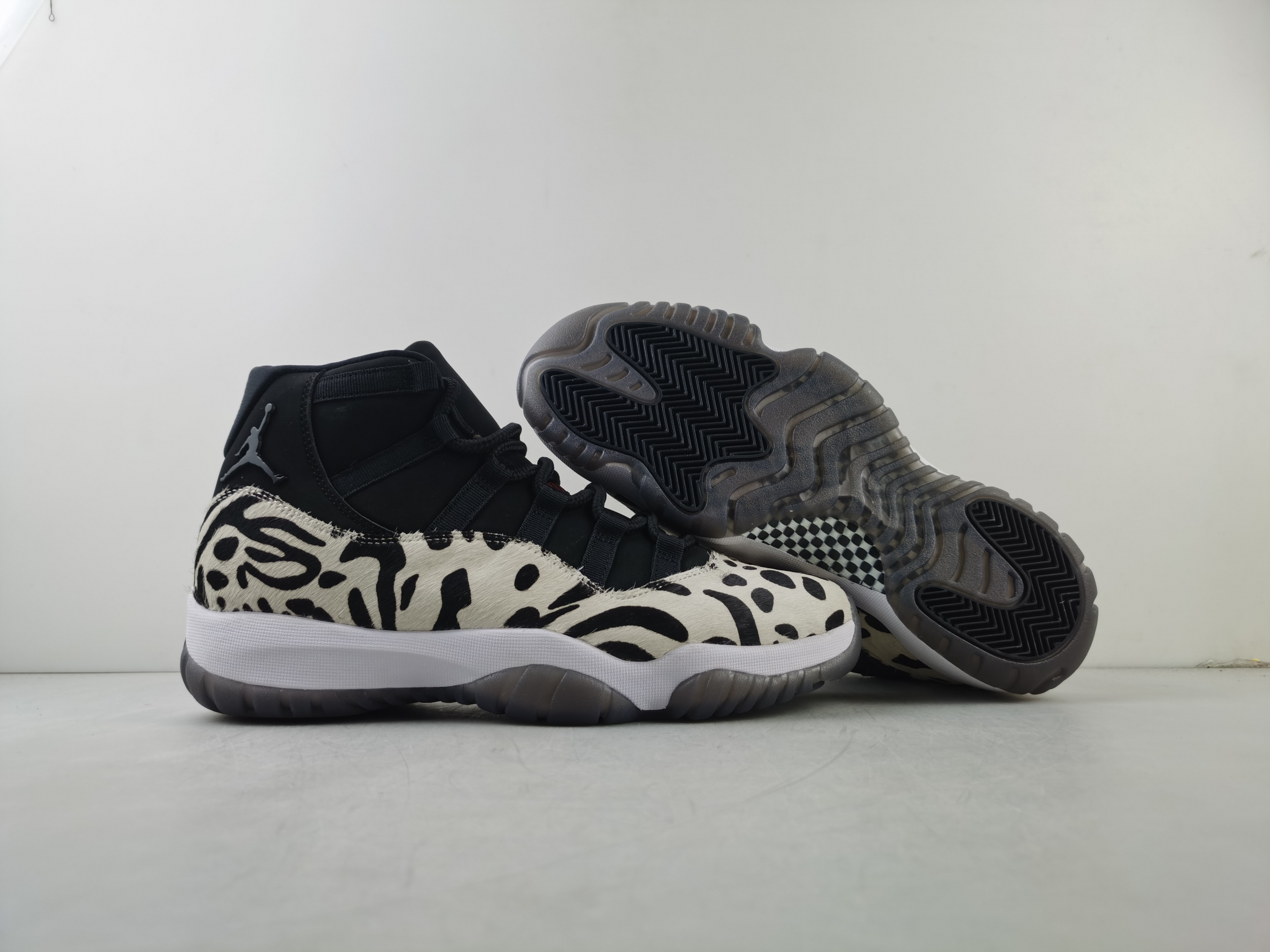 Air Jordan 11 “Animal Instinct” Black / Red / Sail / White