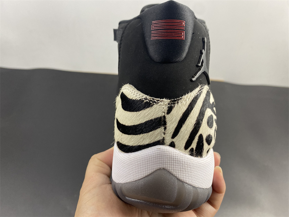 Air Jordan 11 “Animal Instinct” Black / Red / Sail / White